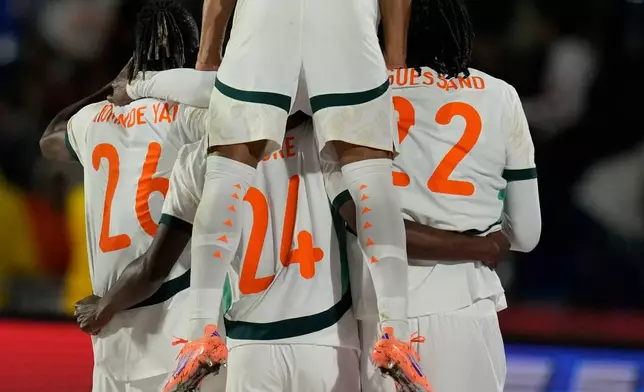 Ivory Coast players celebrate after scoring a goal during the Africa Cup of Nations group F soccer match between Gabon and Ivory Coast, in Marrakech, Morocco, Wednesday, Dec. 31, 2025. (AP Photo/Themba Hadebe)
