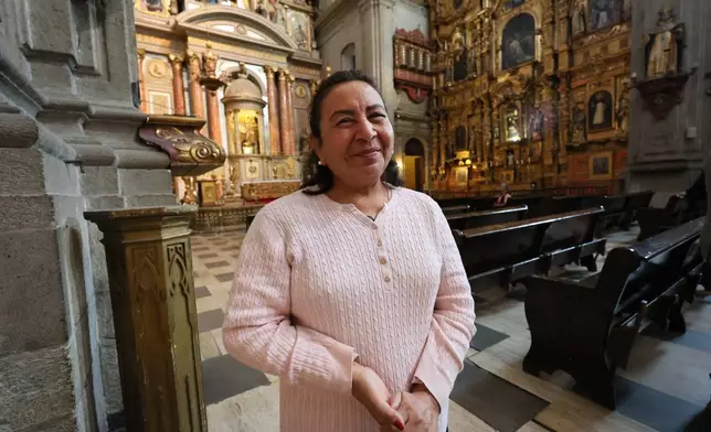 Maria Lourdes Flora, from Yucatan state, visits Santo Domingo church in Mexico City, Tuesday, Jan. 27, 2026. (AP Photo/Ginnette Riquelme)