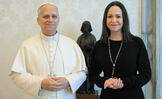 This image released by Vatican Media shows Pope Leo XIV meeting with Nobel Peace Prize laureate María Corina Machado of Venezuela, right, inside his private library at the Vatican, Monday, Jan. 12, 2026. (Vatican Media via AP, HO)