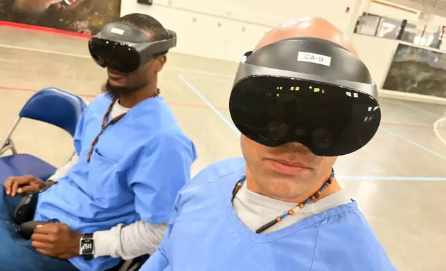 Incarcerated men use virtual reality headsets inside Valley State Prison in Chowchilla, Calif., Dec. 11, 2025. (AP Photo/Haven Daley)