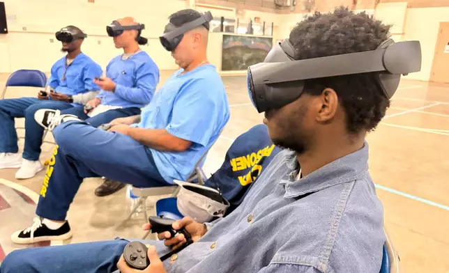 Incarcerated men use virtual reality headsets inside Valley State Prison in Chowchilla, Calif., Dec. 11, 2025. (AP Photo/Haven Daley)