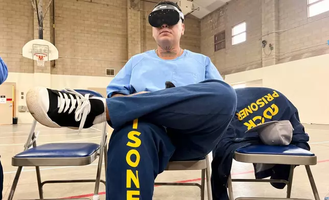 An incarcerated man uses virtual reality headsets inside Valley State Prison in Chowchilla, Calif., Dec. 11, 2025. (AP Photo/Haven Daley)