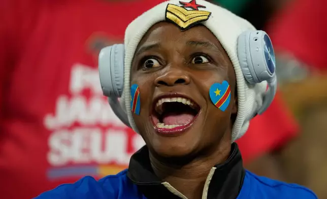 A DR Congo fan cheers prior to the Africa Cup of Nations group D soccer match between Botswana and DR Congo in Rabat, Morocco, Tuesday, Dec. 30, 2025. (AP Photo/Mosa'ab Elshamy)