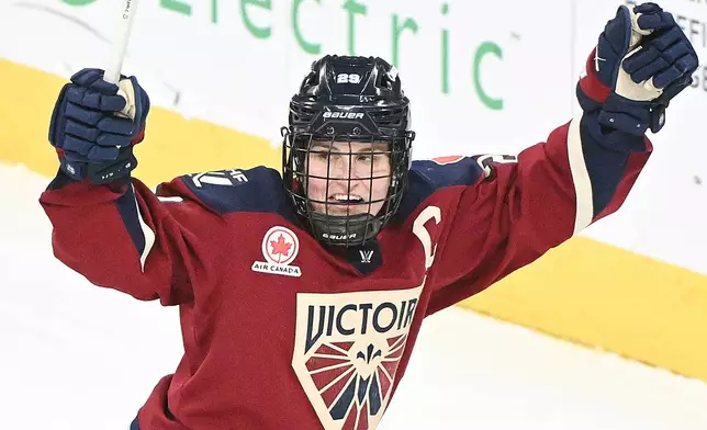 Montreal Victoire's Marie-Philip Poulin (29) reacts after scoring against the Toronto Sceptres during the second period of an PWHL hockey game in Laval, Quebec, Wednesday, Jan. 28, 2026. (Graham Hughes/The Canadian Press via AP)