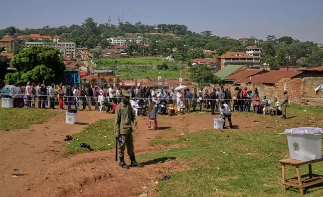 Voters line up to cast their ballots at a polling station, during the presidential election, in the capital, Kampala, Uganda, Thursday, Jan. 15, 2026. (AP Photo/Brian Inganga)