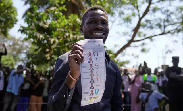 Uganda opposition presidential candidate Robert Kyagulanyi Ssentamu, famously known as Bobi Wine of the National Unity Platform (NUP), casts his vote during the presidential election at a polling station, in Kampala, Uganda, Thursday, Jan. 15, 2026. (AP Photo/Brian Inganga)