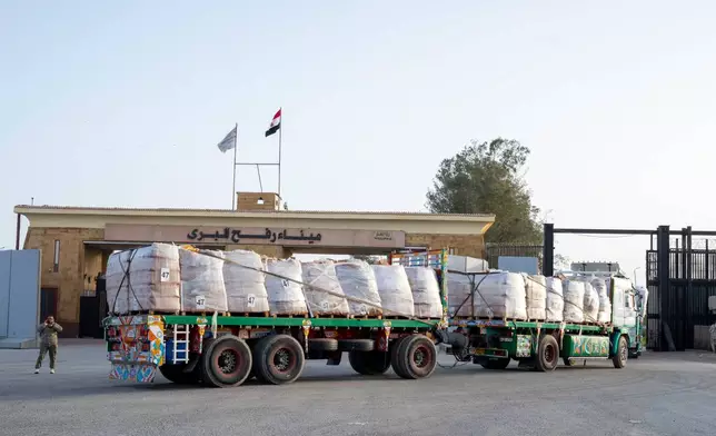 A truck enters the Egyptian gate of the Rafah crossing, heading for inspection by Israeli authorities before entering the Gaza Strip, Tuesday, Jan. 27, 2026. (AP Photo/Mohamed Arafat)