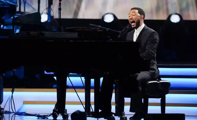 John Legend performs 'Hero' during MusiCares Person of the Year honoring Mariah Carey on Friday, Jan. 30, 2026, in Los Angeles. (AP Photo/Chris Pizzello)