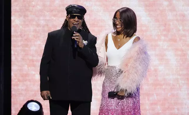 Stevie Wonder, left, and Gayle King speak during MusiCares Person of the Year honoring Mariah Carey on Friday, Jan. 30, 2026, in Los Angeles. (AP Photo/Chris Pizzello)