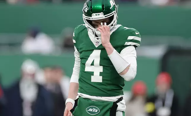 New York Jets quarterback Brady Cook reacts during the second half of an NFL football game against the New England Patriots, Sunday, Dec. 28, 2025, in East Rutherford, N.J. (AP Photo/Adam Hunger)