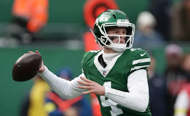 New York Jets quarterback Brady Cook passes against the New England Patriots during the first half of an NFL football game, Sunday, Dec. 28, 2025, in East Rutherford, N.J. (AP Photo/Adam Hunger)