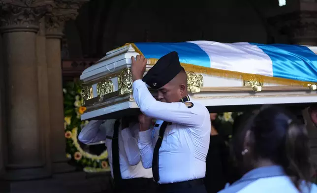 The wake for police officers killed while retaking control of three prisons is held at the Interior Ministry in Guatemala City, Monday, Jan. 19, 2026. (AP Photo/Moises Castillo)