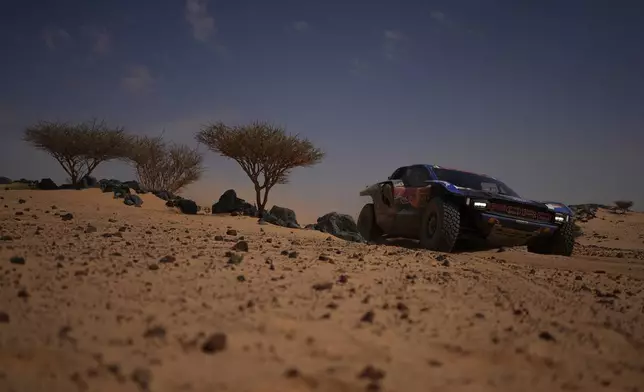 Driver Nani Roma and co-driver Alex Haro compete during the eleventh stage of the Dakar Rally between Bisha and Al Henakiyah, Saudi Arabia, Thursday, Jan.15, 2026. (AP Photo/Thibault Camus)
