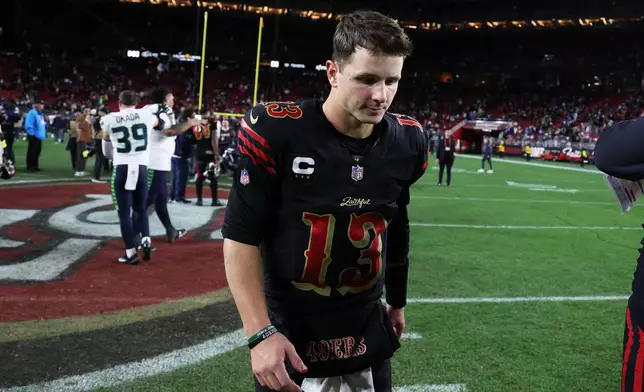 San Francisco 49ers quarterback Brock Purdy (13) walks off the field after an NFL football game against the Seattle Seahawks in Santa Clara, Calif., Saturday, Jan. 3, 2026. (AP Photo/Jed Jacobsohn)