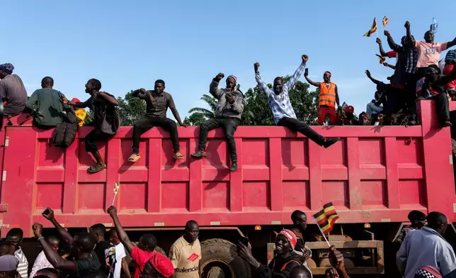 Supporters of Uganda opposition presidential candidate Robert Kyagulanyi Ssentamu, who is known as Bobi Wine attend an election campaign rally in Mukono, Uganda, Friday, Jan. 9, 2026. (AP Photo/Hajarah Nalwadda)