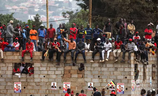 Supporters of Uganda opposition presidential candidate Robert Kyagulanyi Ssentamu who is known as Bobi Wine attend an election campaign rally in Mukono, Uganda, Friday, Jan. 9, 2026. (AP Photo/Hajarah Nalwadda)