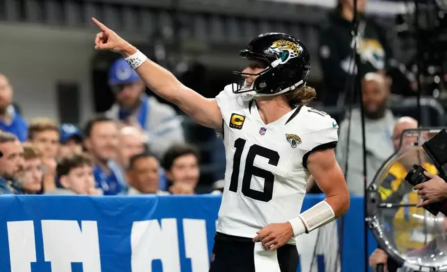 Jacksonville Jaguars quarterback Trevor Lawrence celebrates after scoring during the second half of an NFL football game against the Indianapolis Colts Sunday, Dec. 28, 2025, in Indianapolis. (AP Photo/Carolyn Kaster)