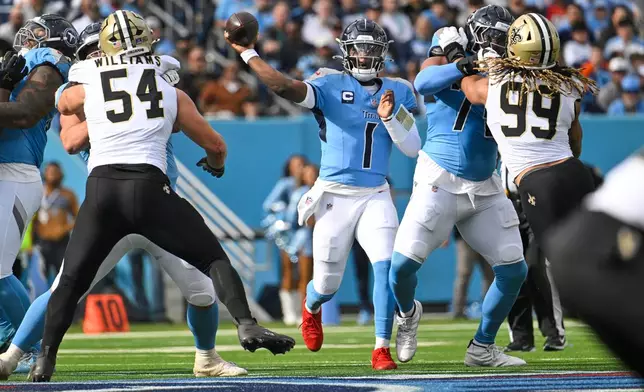 Tennessee Titans quarterback Cam Ward (1) passes against the New Orleans Saints in the first half of an NFL football game, Sunday, Dec. 28, 2025, in Nashville, Tenn. (AP Photo/John Amis)