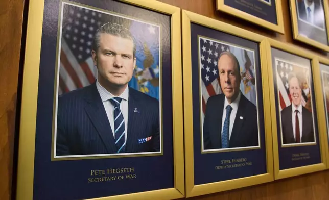 FILE - Department leadership portraits are displayed in the Pentagon after President Donald Trump signed an executive order aiming to rename the Department of Defense the Department of War in Washington, Sept. 9, 2025. (AP Photo/Jacquelyn Martin, File)