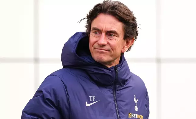 Tottenham Hotspur manager Thomas Frank looks on during a training session in London, Monday Jan. 19, 2026, one day ahead of their Champions League soccer match against Borussia Dortmund. (Bradley Collyer/PA via AP)