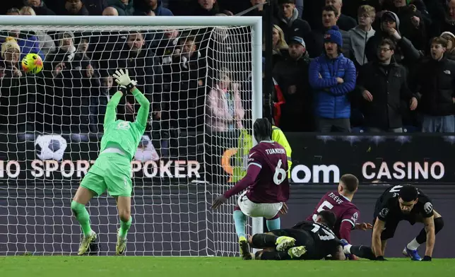 Tottenham Hotspur's Cristian Romero scores his side's second goal of the game, during the English Premier League soccer match between Burnley and Tottenham Hotspur, at Turf Moor, in Burnley, England, Saturday, Jan. 24, 2026. (Richard Sellers/PA via AP)