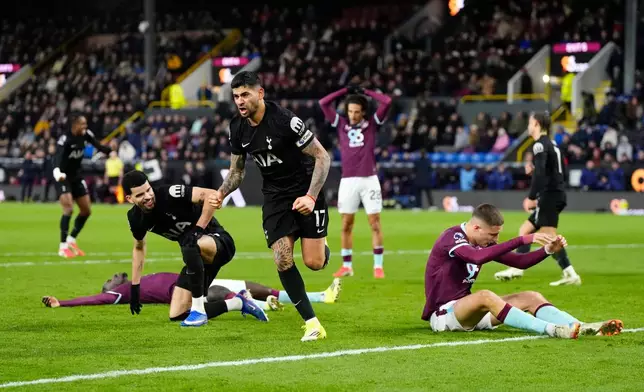Tottenham Hotspur's Cristian Romero, center celebrates scoring his side's second goal of the game, during the English Premier League soccer match between Burnley and Tottenham Hotspur, at Turf Moor, in Burnley, England, Saturday, Jan. 24, 2026. (Richard Sellers/PA via AP)