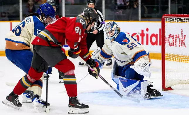Ottawa Charge's Ronja Savolainen (88) scores against Vancouver Goldeneyes goaltender Kristen Campbell (50) during first-period PWHL hockey game action in Ottawa, Ontario, Friday, Jan. 9, 2026. (Spencer Colby/The Canadian Press via AP)