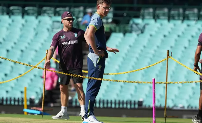 Australia's Todd Murphy looks at the pitch ahead of play on day one of the fifth and final Ashes cricket test between England and Australia in Sydney, Sunday, Jan. 4, 2026. (AP Photo/Mark Baker)