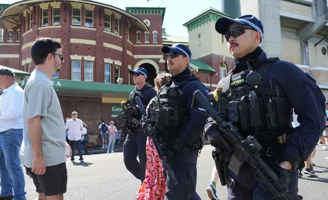 Police patrol outside the Sydney Cricket Ground ahead of play on day one of the fifth and final Ashes cricket test between England and Australia in Sydney, Sunday, Jan. 4, 2026. (AP Photo/Mark Baker)
