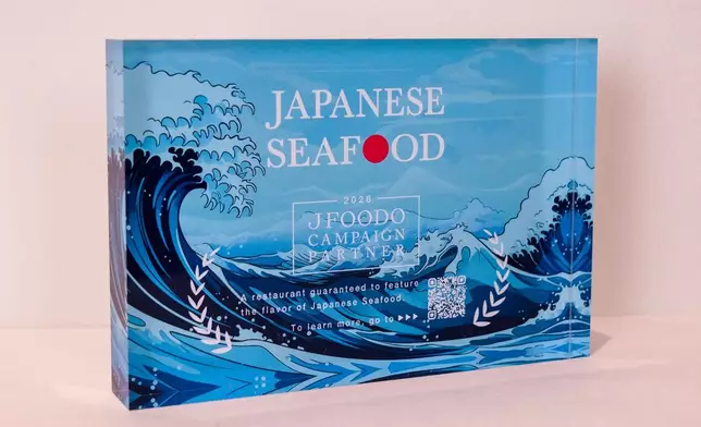 A stand displaying the logo, installed at partner restaurants