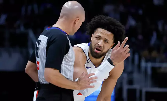 Detroit Pistons guard Cade Cunningham, right, complains to referee Jacyn Goble during the first half of an NBA basketball game against the Boston Celtics Monday, Jan. 19, 2026, in Detroit. (AP Photo/Duane Burleson)