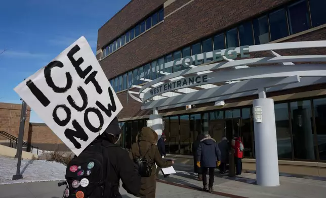 People arrive for an MLK rally on, Monday, Jan. 19, 2026 in St. Paul, Minn. (AP Photo/Angelina Katsanis)