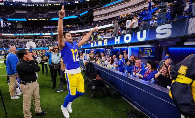 Los Angeles Rams wide receiver Puka Nacua (12) celebrates with fans as he exits the field following the team's victory over the Arizona Cardinals in an NFL football game, Sunday, Jan. 4, 2026, in Inglewood, Calif. (AP Photo/Mark J. Terrill)