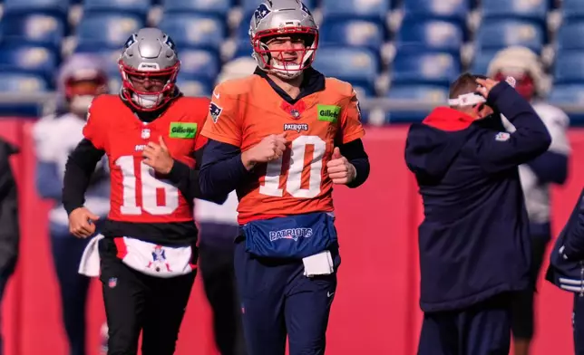 New England Patriots quarterback Drake Maye (10) runs with teammates during a football availability, Friday, Jan. 23, 2026, in Foxborough, Mass. (AP Photo/Charles Krupa)