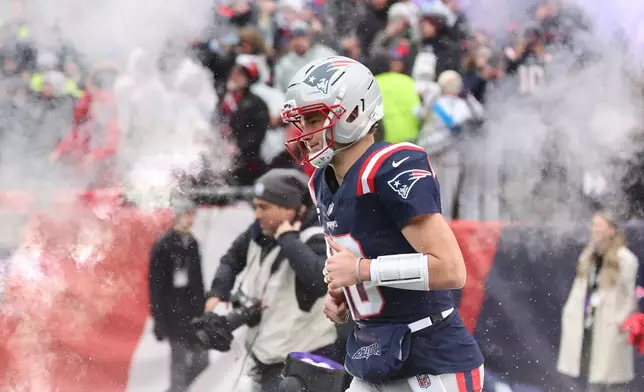 New England Patriots quarterback Drake Maye is introduced before an NFL divisional playoff football game against the Houston Texans, Sunday, Jan. 18, 2026, in Foxborough, Mass. (AP Photo/Mark Stockwell)