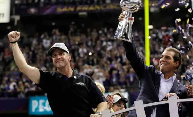 FILE -Baltimore Ravens owner Stephen J. Bisciotti, right, holds up the Vince Lombardi Trophy as he and head coach John Harbaugh celebrate the team's 34-31win against the San Francisco 49ers in the NFL Super Bowl XLVII football game, Sunday, Feb. 3, 2013, in New Orleans. (AP Photo/Matt Slocum, File)