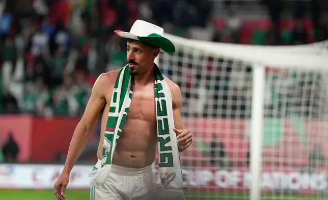 Algeria's Baghdad Bounedjah celebrates after the Africa Cup of Nations round of 16 soccer match between Algeria and DR Congo in Rabat, Morocco, Tuesday, Jan. 6, 2026. (AP Photo/Mosa'ab Elshamy)