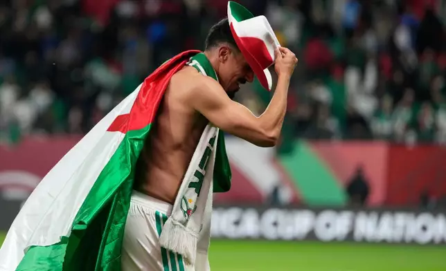 Algeria's Baghdad Bounedjah celebrates after the Africa Cup of Nations round of 16 soccer match between Algeria and DR Congo in Rabat, Morocco, Tuesday, Jan. 6, 2026. (AP Photo/Mosa'ab Elshamy)