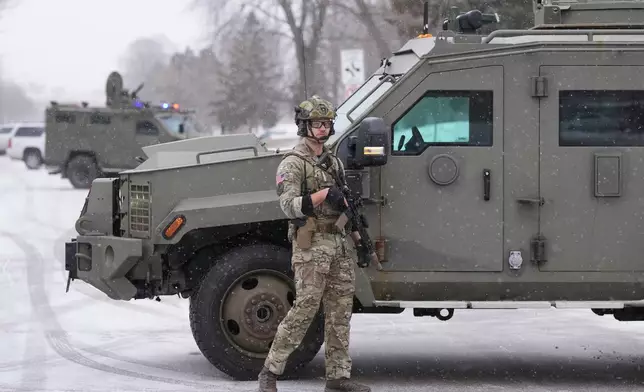 An FBI officer works the scene during operations on Friday, Jan. 16, 2026, in St. Paul, Minn. (AP Photo/Adam Gray)