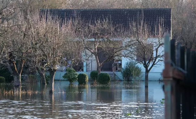 A house in the village of Klikovace, in Montenegro, after heavy rainfall this week, Thursday, Jan. 8, 2026. (AP Photo/Risto Bozovic)