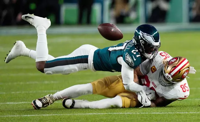 Philadelphia Eagles cornerback Quinyon Mitchell (27) breaks up a pass intended for San Francisco 49ers tight end George Kittle (85) during the first half of an NFL wild-card playoff football game Sunday, Jan. 11, 2026, in Philadelphia. (AP Photo/Chris Szagola)