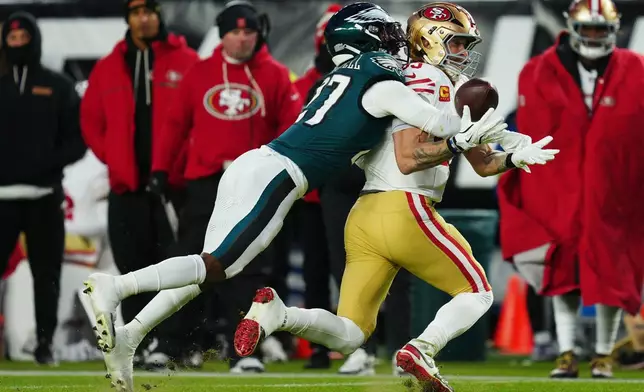 Philadelphia Eagles cornerback Quinyon Mitchell (27) breaks up a pass intended for San Francisco 49ers tight end George Kittle (85) during the first half of an NFL wild-card playoff football game Sunday, Jan. 11, 2026, in Philadelphia. (AP Photo/Derik Hamilton)