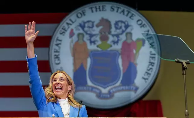 New Jersey Gov. Mikie Sherrill prepares to speak after taking the oath of office during an inauguration ceremony, Tuesday, Jan. 20, 2026, in Newark, N.J. (AP Photo/Seth Wenig)