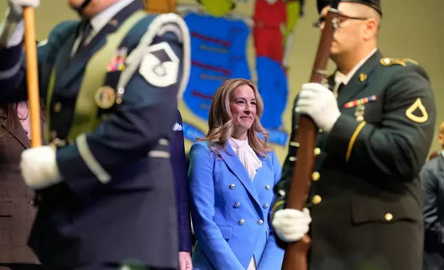 New Jersey Gov. Mikie Sherrill stands as an honor guard passes by during her inauguration ceremony in Newark, N.J., Tuesday, Jan. 20, 2026. (AP Photo/Seth Wenig)