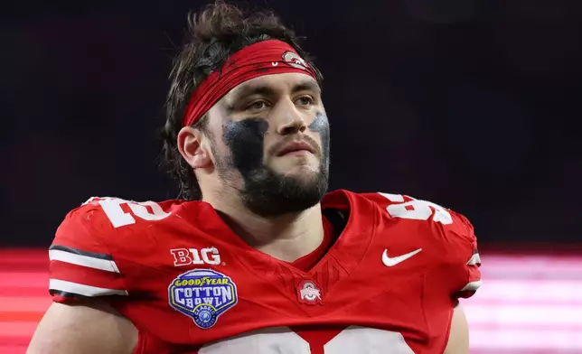 Ohio State defensive end Caden Curry looks on during the first half of the Cotton Bowl College Football Playoff quarterfinal game against Miami Wednesday, Dec. 31, 2025, in Arlington, Texas. (AP Photo/Gareth Patterson)