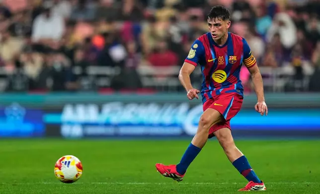 Barcelona's Pedri controls the ball during the Spanish Super Cup semifinal soccer match against Athletic Club Bilbao at King Abdullah Sports City Stadium in Jeddah, Saudi Arabia, Wednesday, Jan. 7, 2026. (AP Photo/Altaf Qadri)