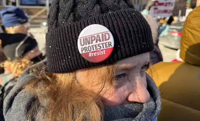 People participate in an anti-ICE rally Sunday, Jan. 25, 2026, in Minneapolis. (AP Photo/Jack Brook)