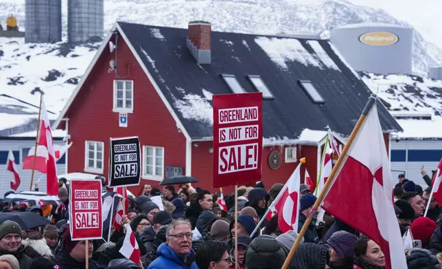 People protest against Trump's policy towards Greenland in front of US consulate in Nuuk, Greenland, Saturday, Jan. 17, 2026. (AP Photo/Evgeniy Maloletka)