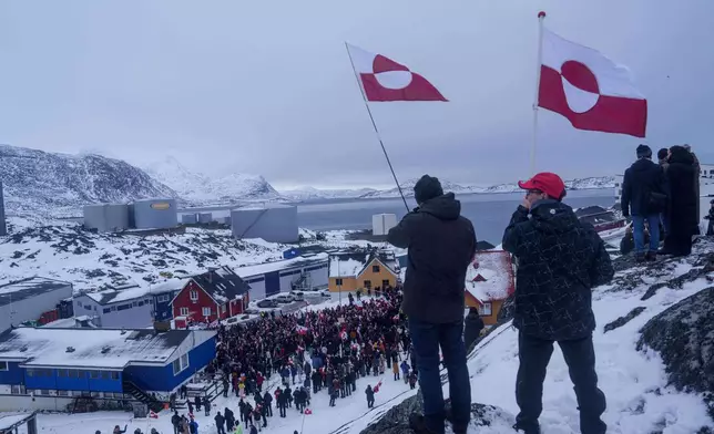 People protest against Trump's policy towards Greenland in front of US consulate in Nuuk, Greenland, Saturday, Jan. 17, 2026. (AP Photo/Evgeniy Maloletka)