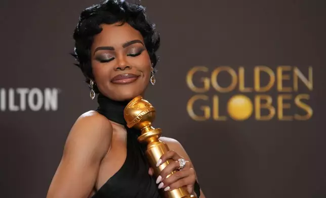 Teyana Taylor poses in the press room with the award for best performance by a female actor in a supporting role in any motion picture for "One Battle After Another" during the 83rd Golden Globes on Sunday, Jan. 11, 2026, at the Beverly Hilton in Beverly Hills, Calif. (AP Photo/Chris Pizzello)
